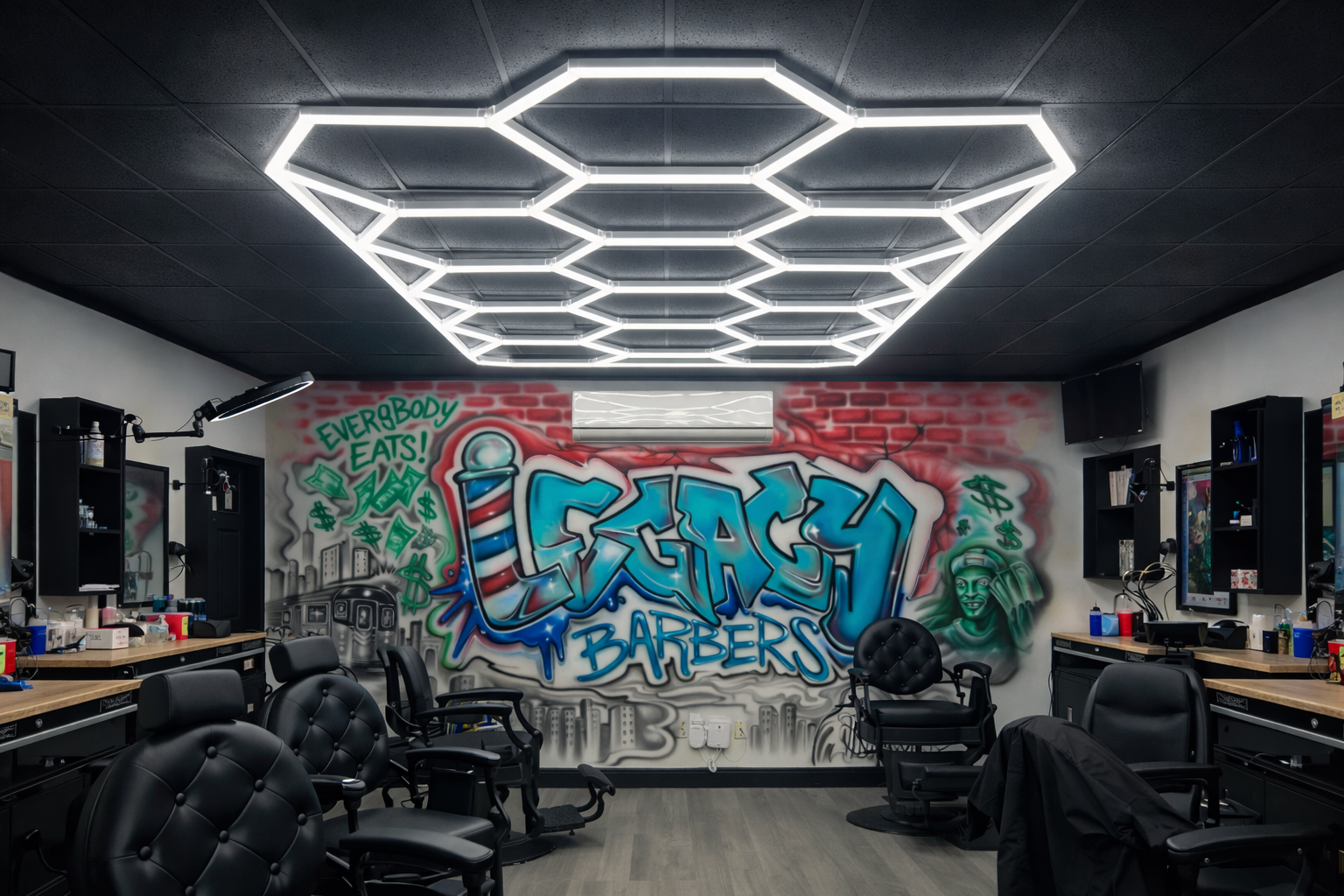 Legacy Barbers interior — hexagonal ceiling lights and graffiti mural